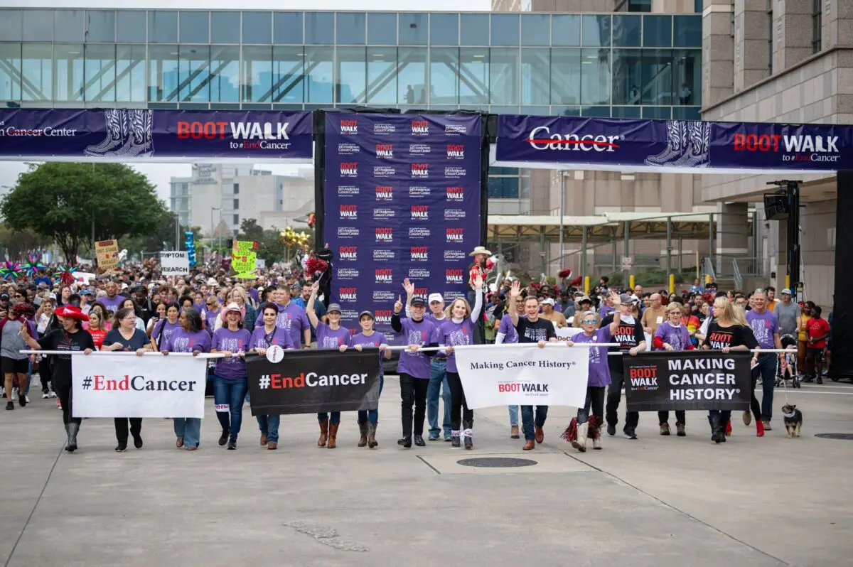 Participants carry End Cancer banners at the MD Anderson Boot Walk.