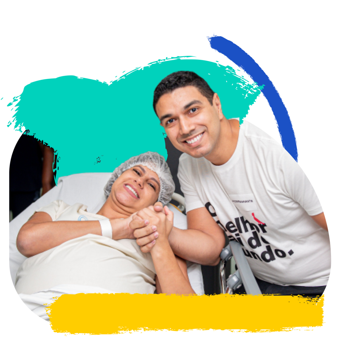A volunteer supports a patient seated in a hospital chair.