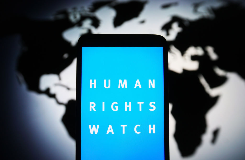 In this photo illustration, Human Rights Watch (HRW) logo is seen on a smartphone screen. (Photo Illustration by Pavlo Gonchar/SOPA Images/LightRocket via Getty Images)