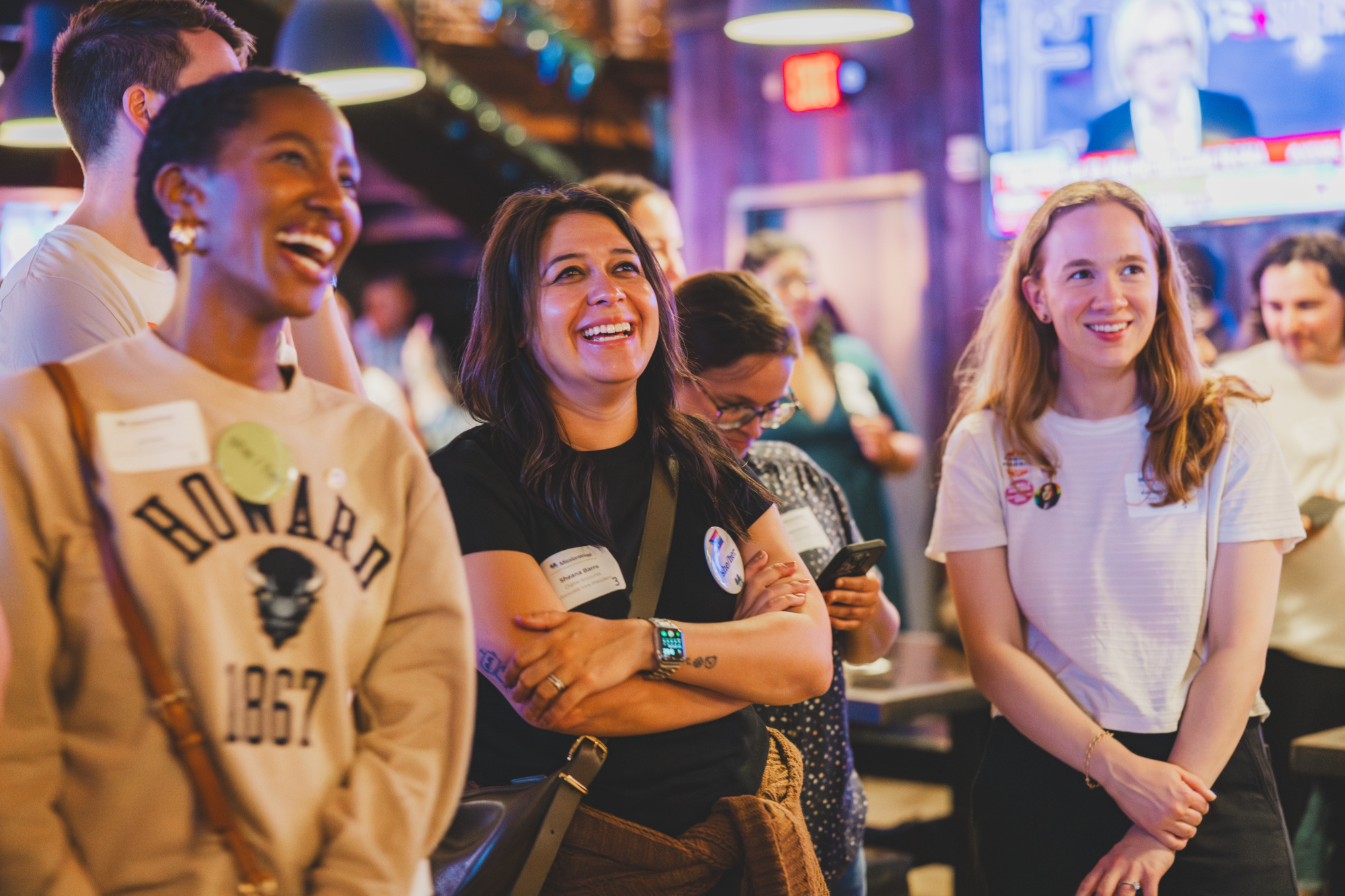 Three MissionWired staff members celebrate at our Election Night Watch Party.