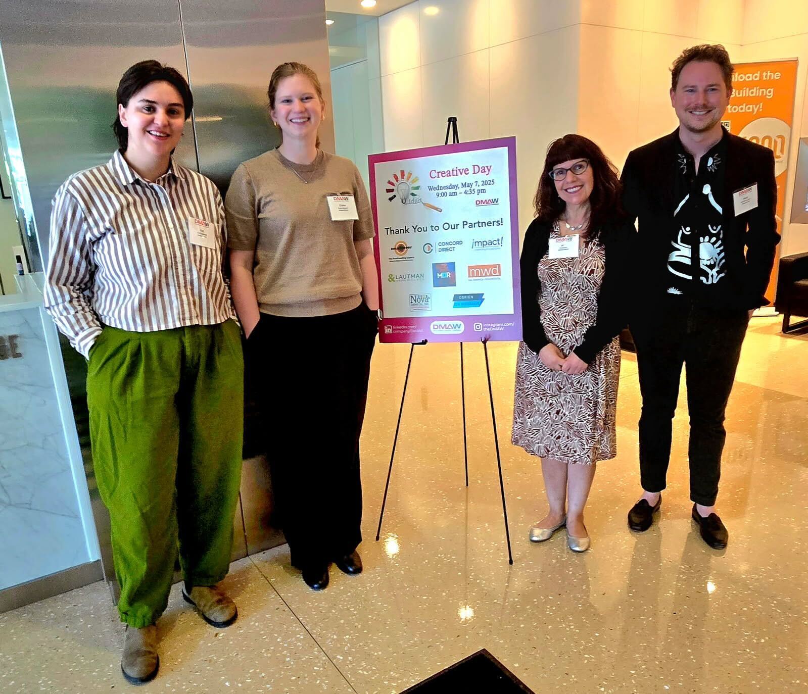 Four members of our creative team posing at DMAW Creative Day.