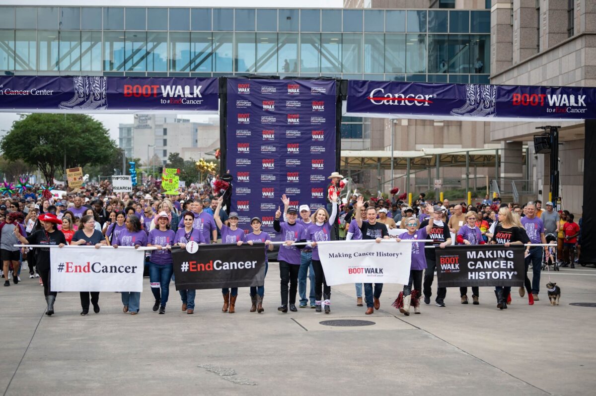 Participants carry End Cancer banners at the MD Anderson Boot Walk.