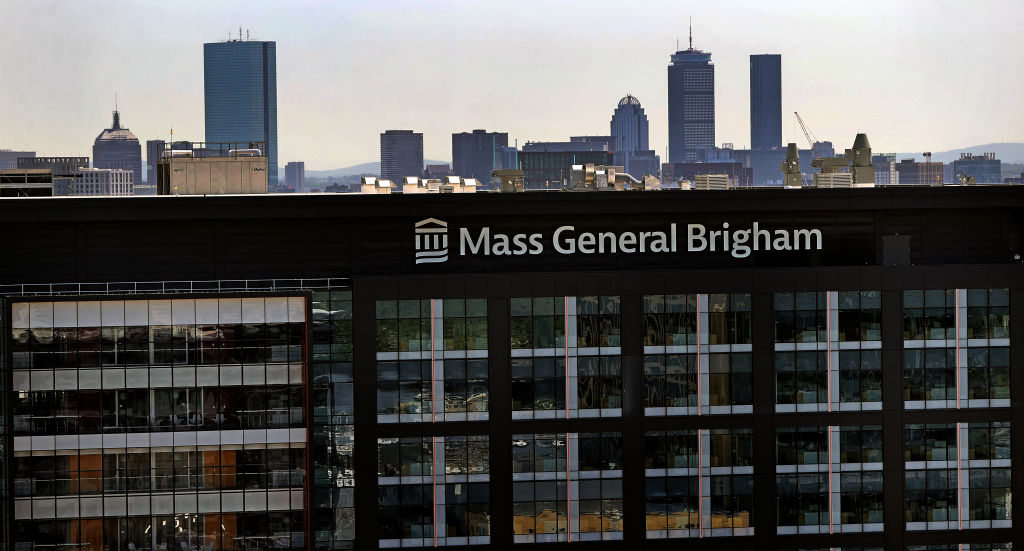 Mass General Brigham building with the Boston skyline in the background.
