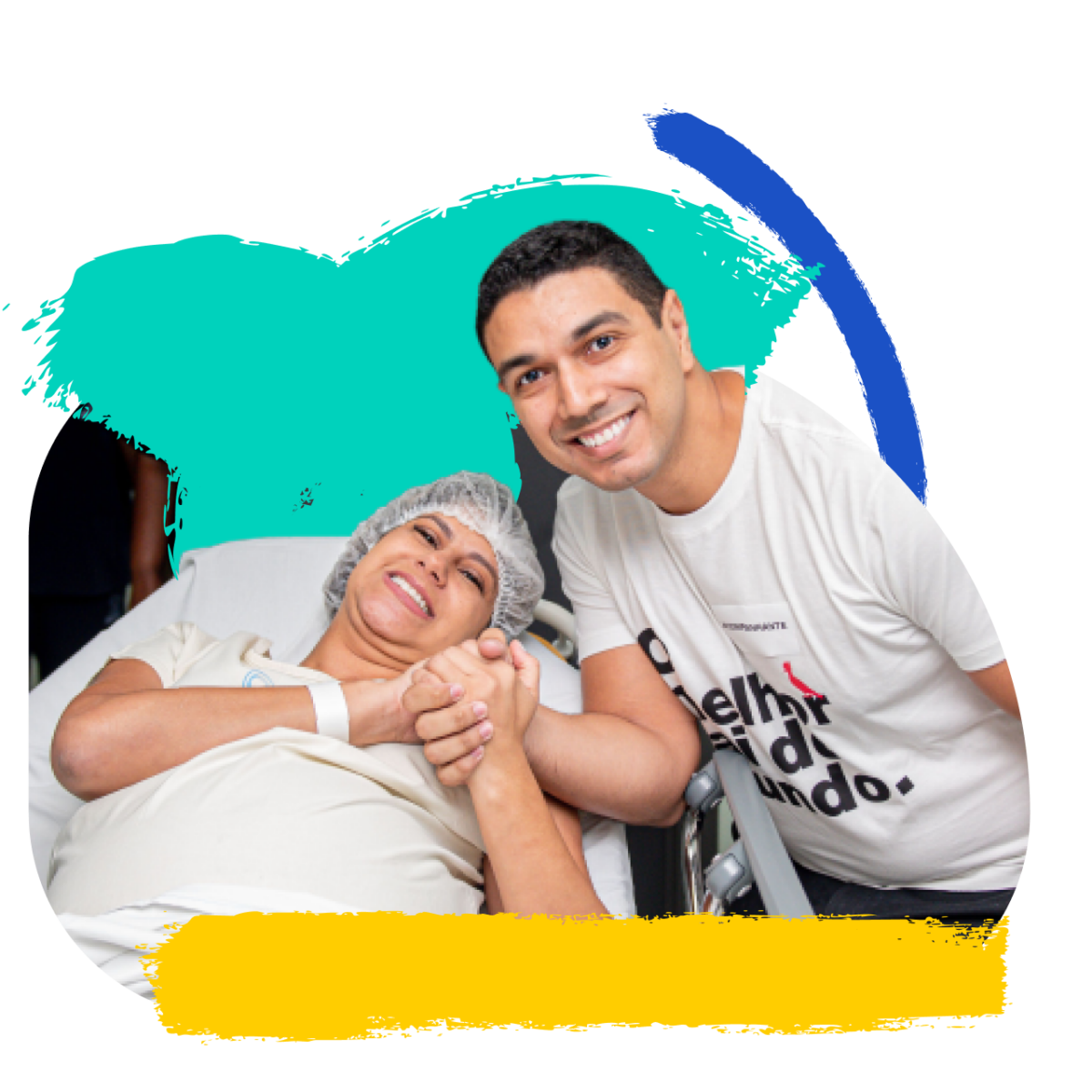 A volunteer supports a patient seated in a hospital chair.